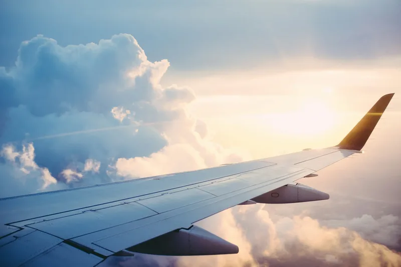 Airplane wing at sunrise